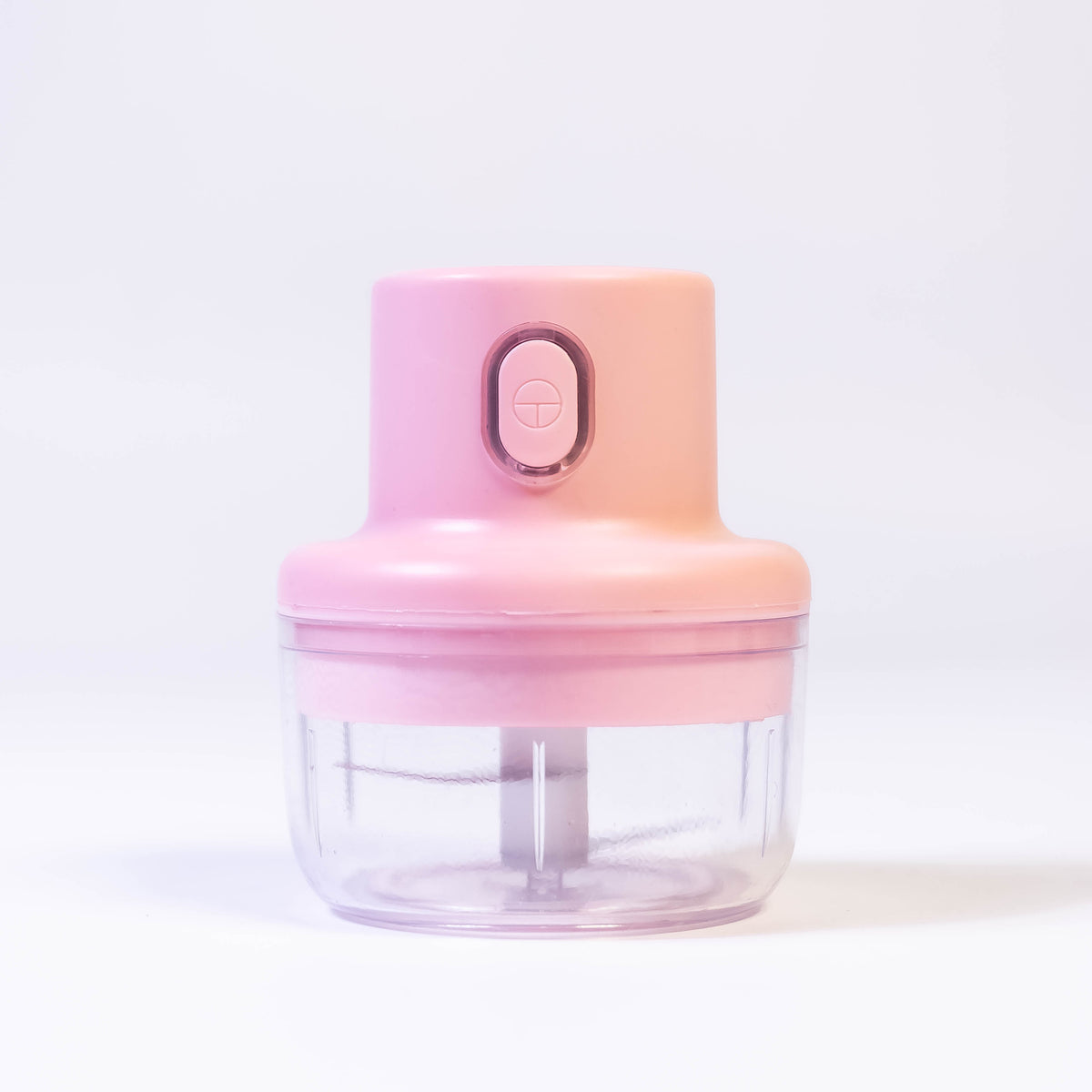 Zoni Stores mini electric food chopper and grinder with clear bowl and stainless steel blades on a kitchen countertop.