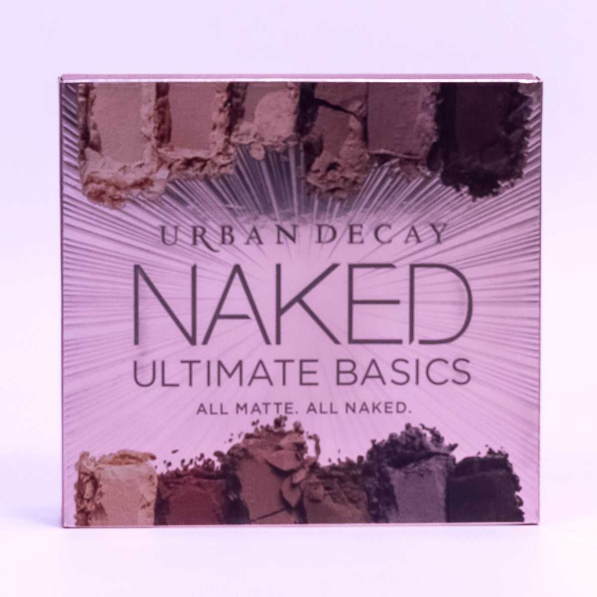 Urban Decay Naked Ultimate Basics all-matte eyeshadow palette with neutral shades, displayed in a sleek compact.