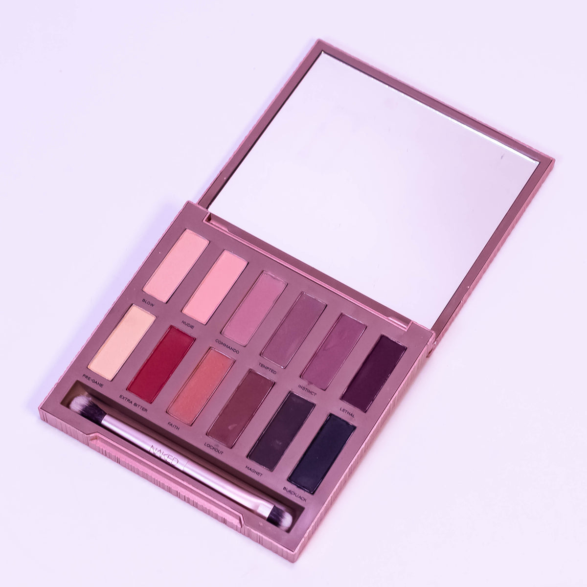 Urban Decay Naked Ultimate Basics matte eyeshadow palette with neutral shades, open to show multiple all-matte eye shadow pans.