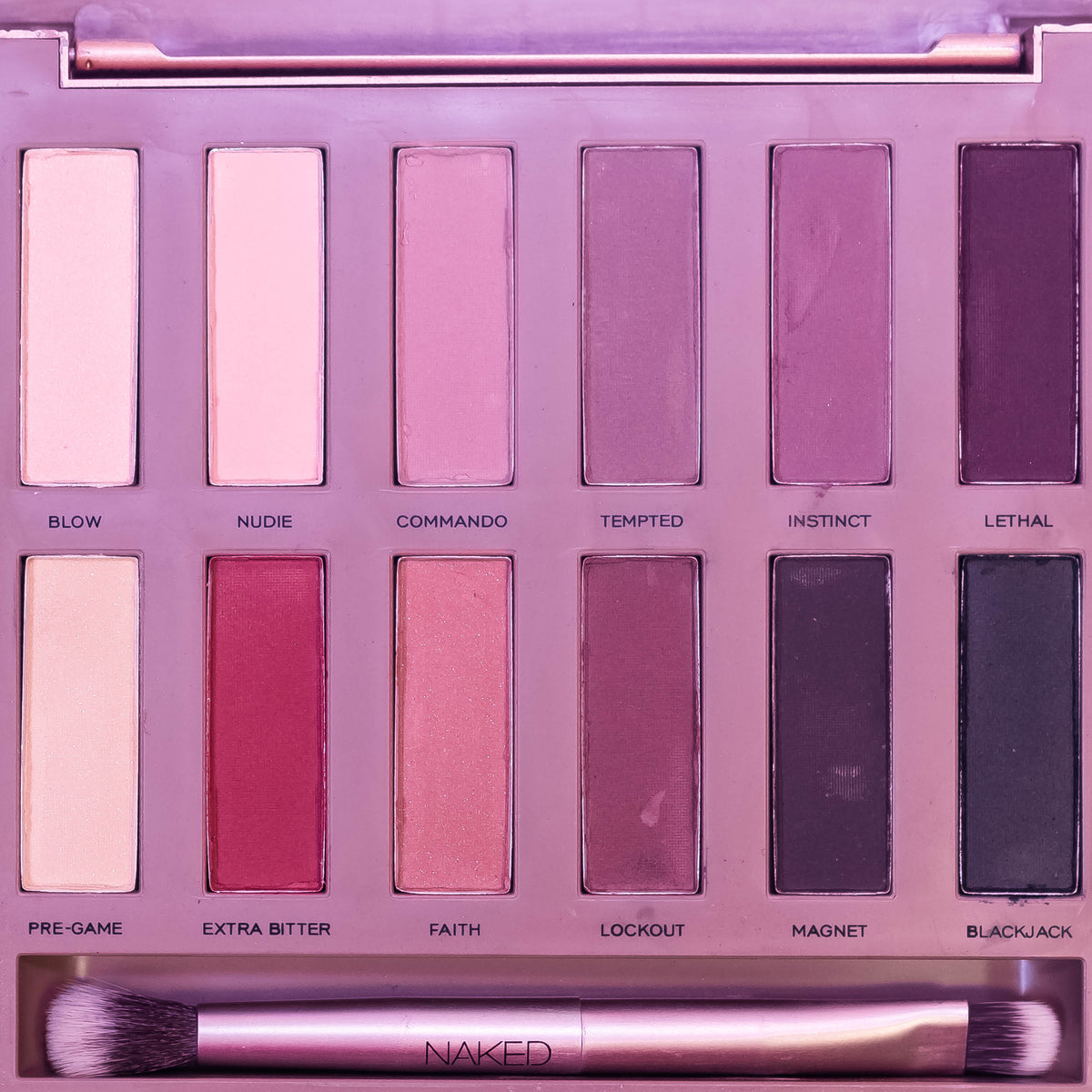 Urban Decay Naked Ultimate Basics matte eyeshadow palette with neutral shades, open to reveal all-matte eyeshadow pans.