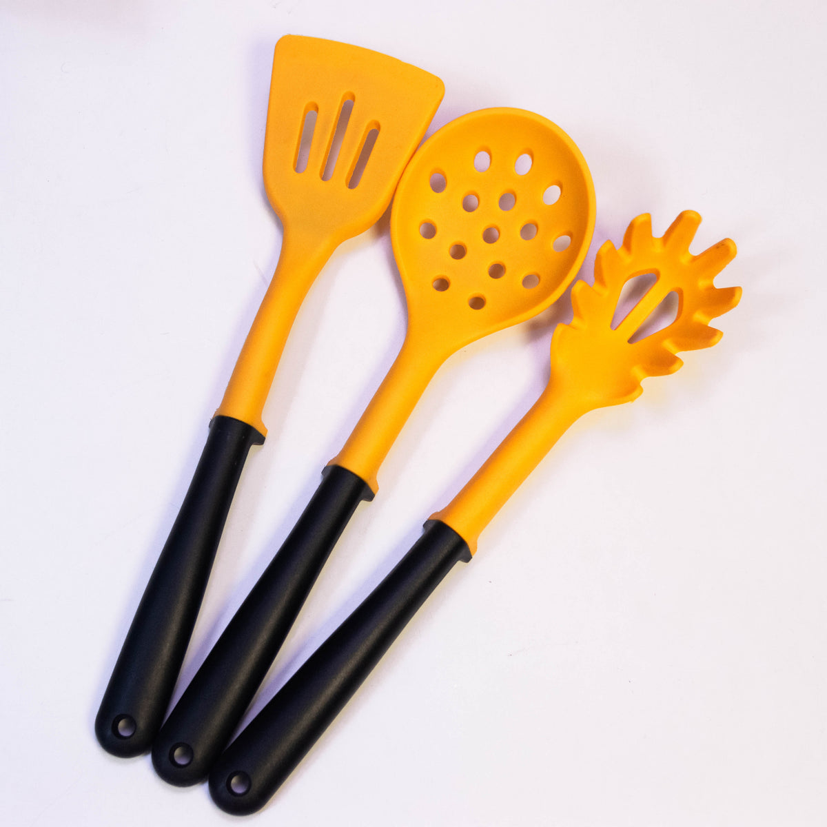 Set of three silicone utensils including spatula, spoon, and turner from Zoni Stores' Dynamic Trio Silicone Utensils Set.