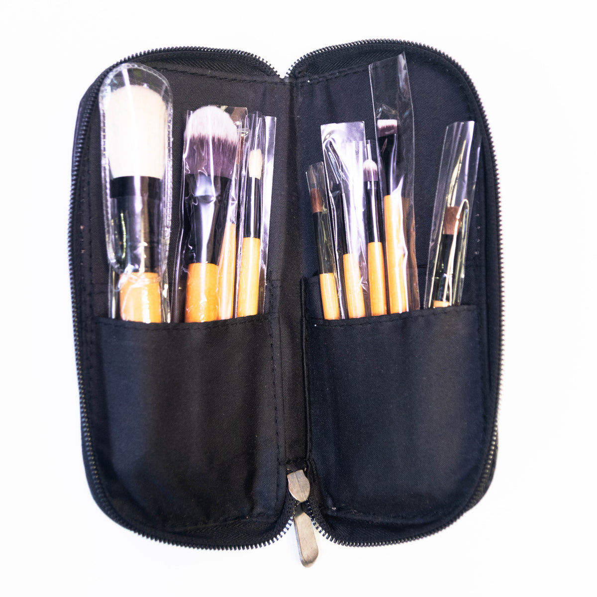 Set of nine Zoni Stores makeup brushes from LAROC Cosmetics, featuring various brush types for face and eye makeup application.