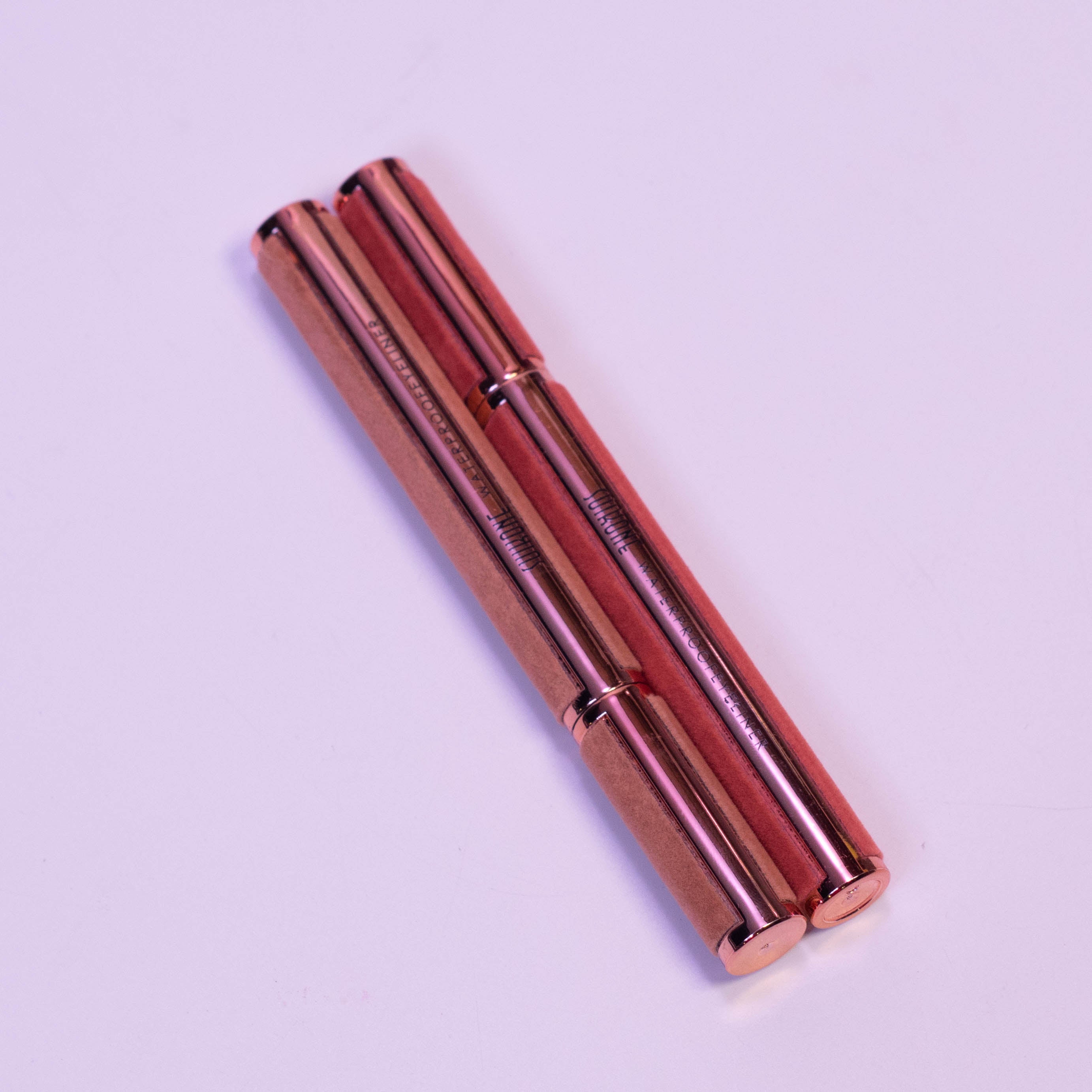 Zoni Stores Aqua Define SUIKONE waterproof eyeliner pencil with black pigment, shown with the product cap and tip visible.