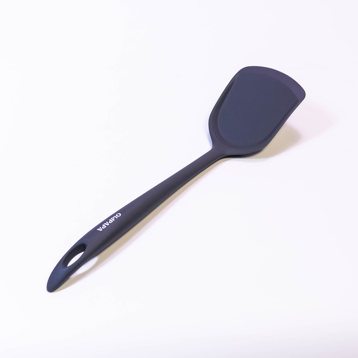 Black silicone slotted turner spatula by Zoni Stores, heat-resistant kitchen utensil for flipping and serving food.