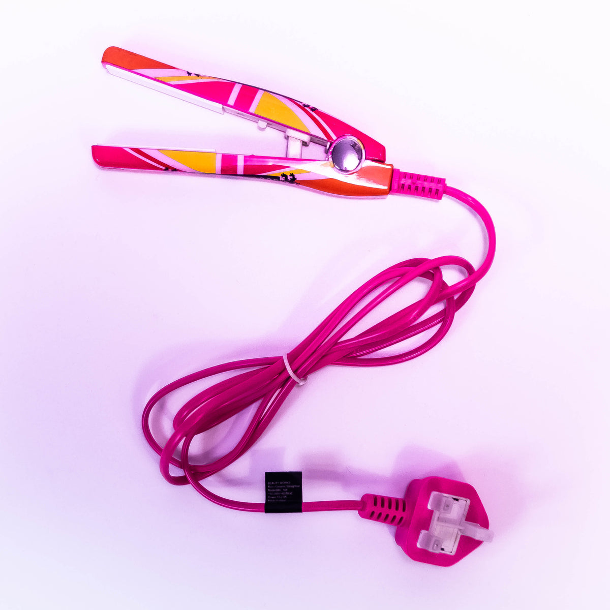 Zoni Stores Cool Britannia Mini Baby Hair Straightener with ceramic plates on a white background.