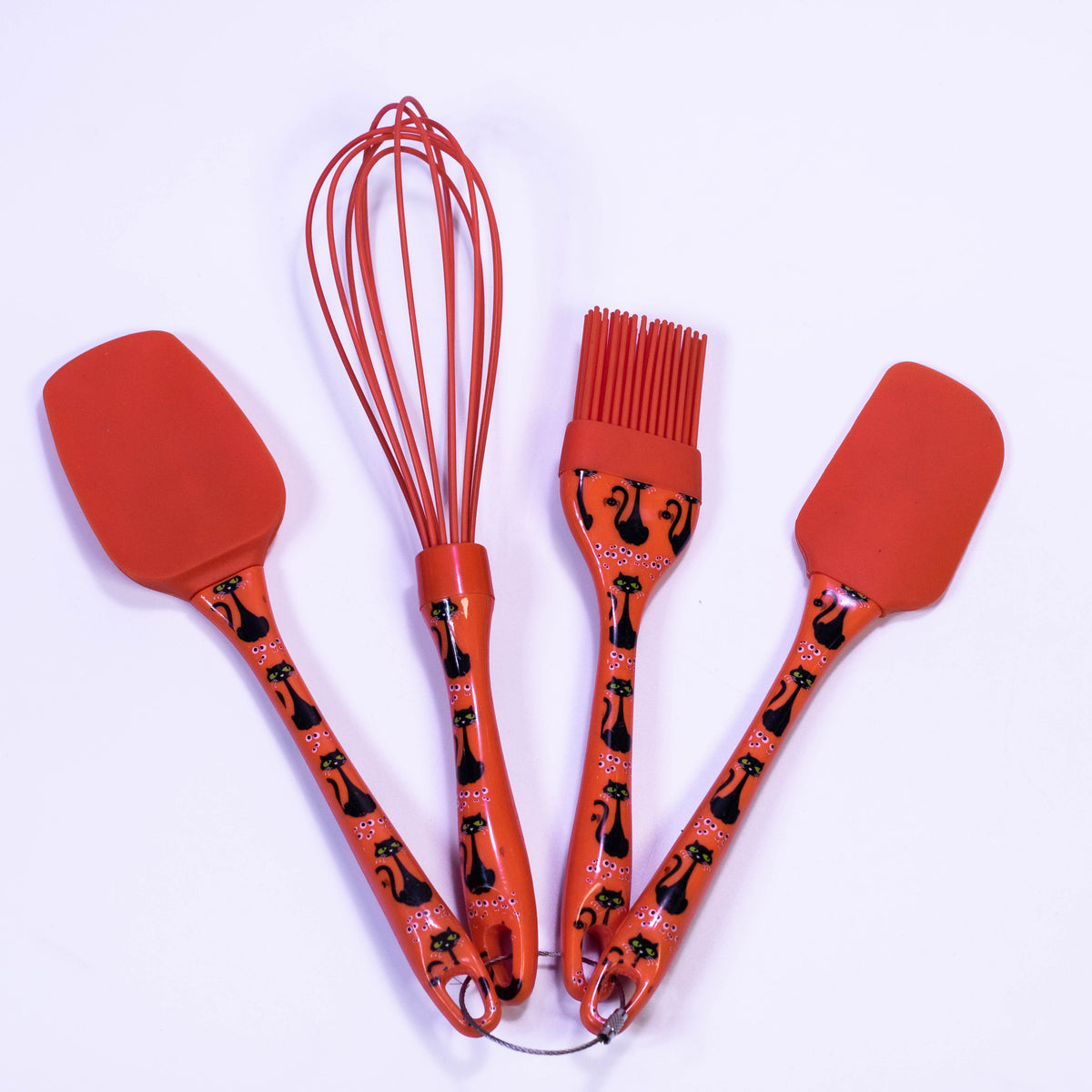 ZoniStores CulinaryEssentials kitchen wear set with utensils, oven mitts, and accessories arranged for cooking prep.