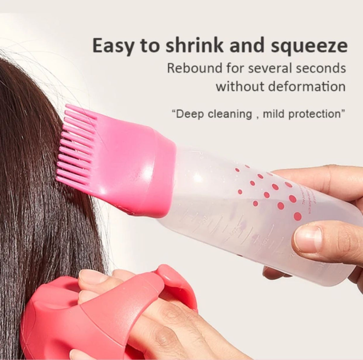 Pink root comb applicator bottle used for applying hair dye and oil to the scalp available at Zonistores Pakistan.