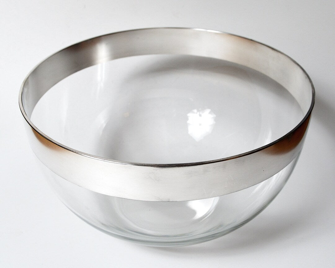 An elegant serving bowl with metallic rims, sold by Zoni Stores