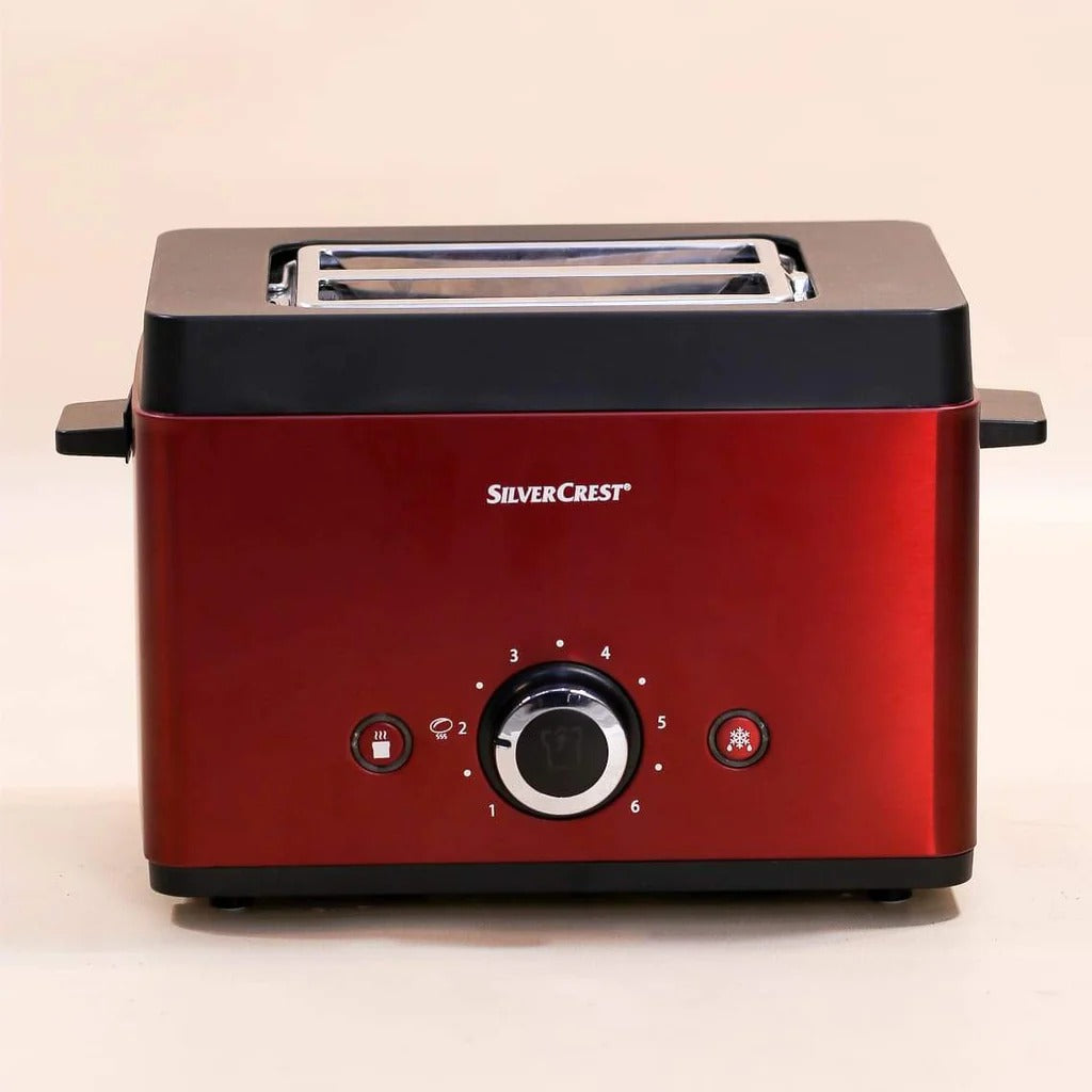 Silver Crest toaster from Zoni Stores with four slots, stainless steel finish, and control knobs for browning adjustment.