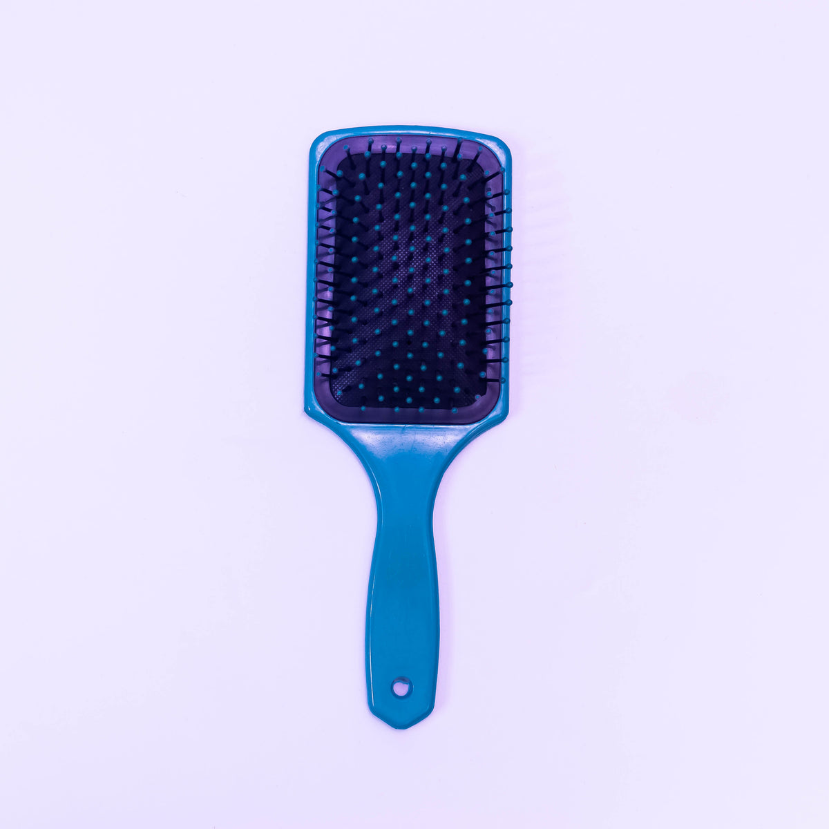 Sky blue printed Zoni Stores hair brush with ergonomic handle and bristles for gentle hair detangling.