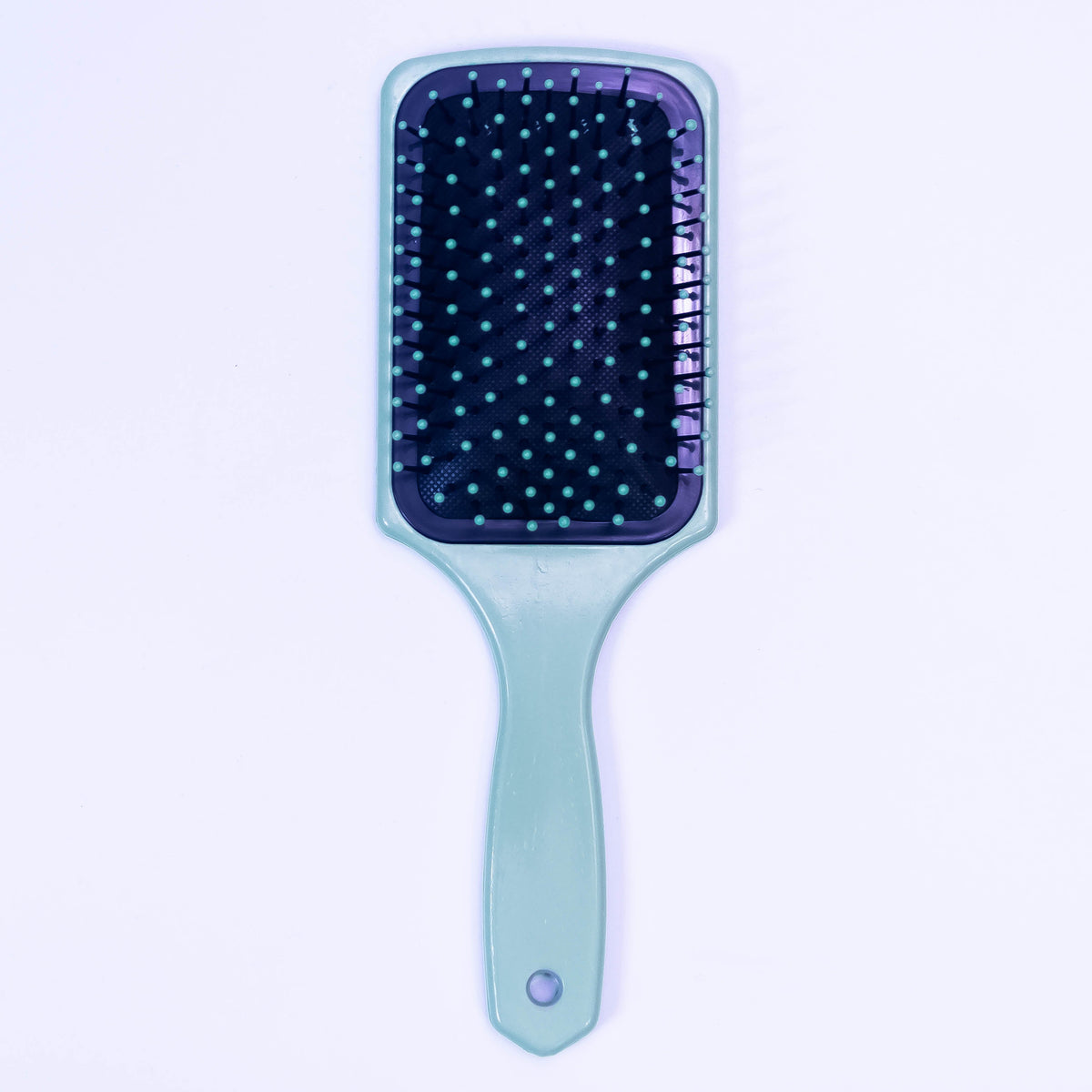 Sea green printed hair brush by Zoni Stores with ergonomic handle and detailed design, ideal for detangling and styling hair.