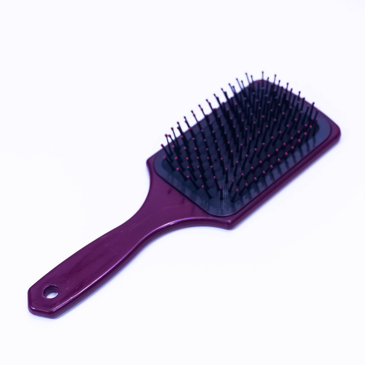 Printed Choco Color Hair Brush by Zoni Stores, showing close-up of the textured, ergonomic design on a white background.