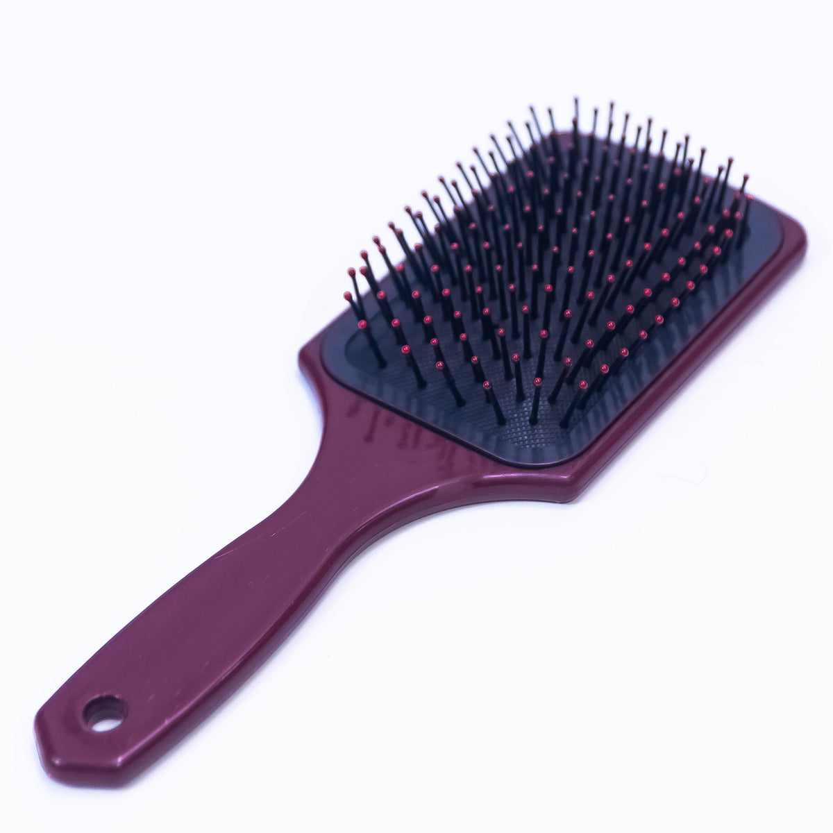 Printed Choco Color Hair Brush by Zoni Stores with ergonomic handle and bristles for gentle detangling.