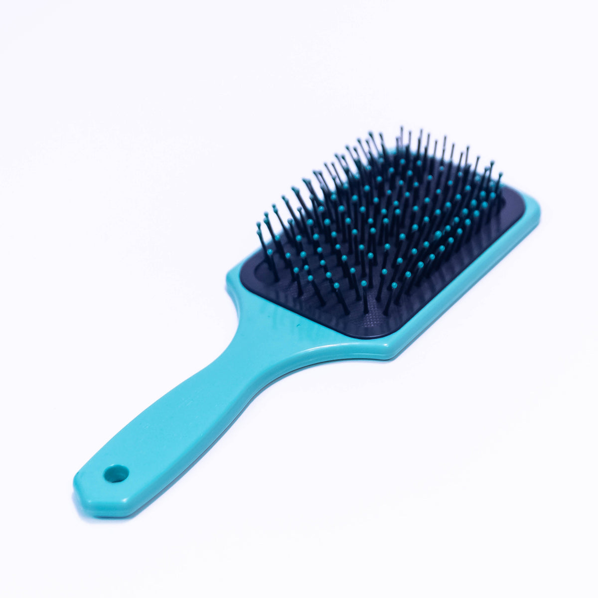 Winter Deer printed hair brush by Zoni Stores with a colorful, nature-inspired deer design on a black handle.