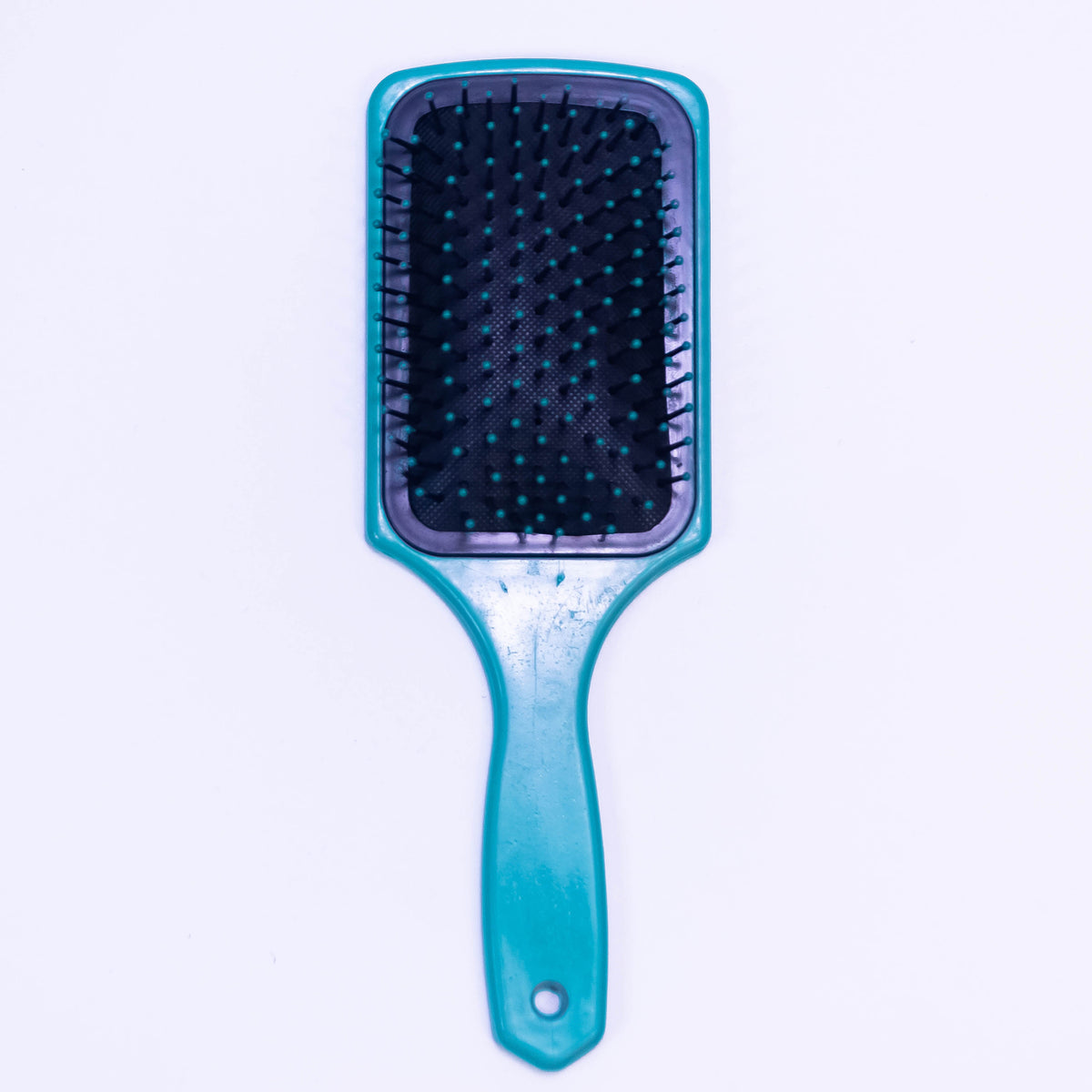 Blue mosaic print Zoni Stores hair brush with a patterned design and ergonomic handle, suitable for detangling and styling hair.