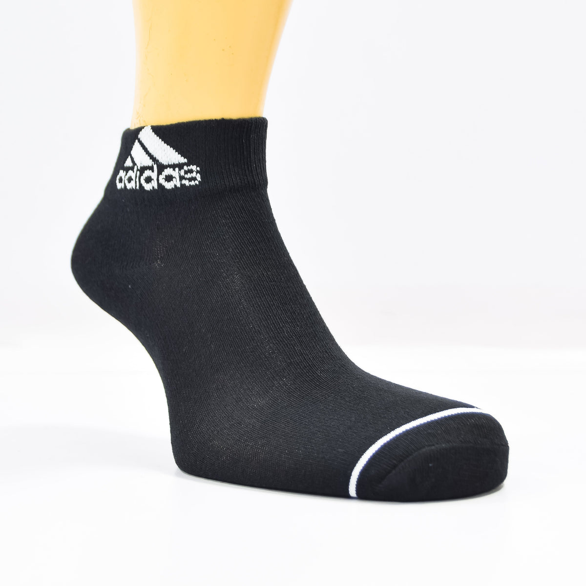 Pack of three black Adidas ankle socks from Zoni Stores, showing the socks laid flat with logo details visible.