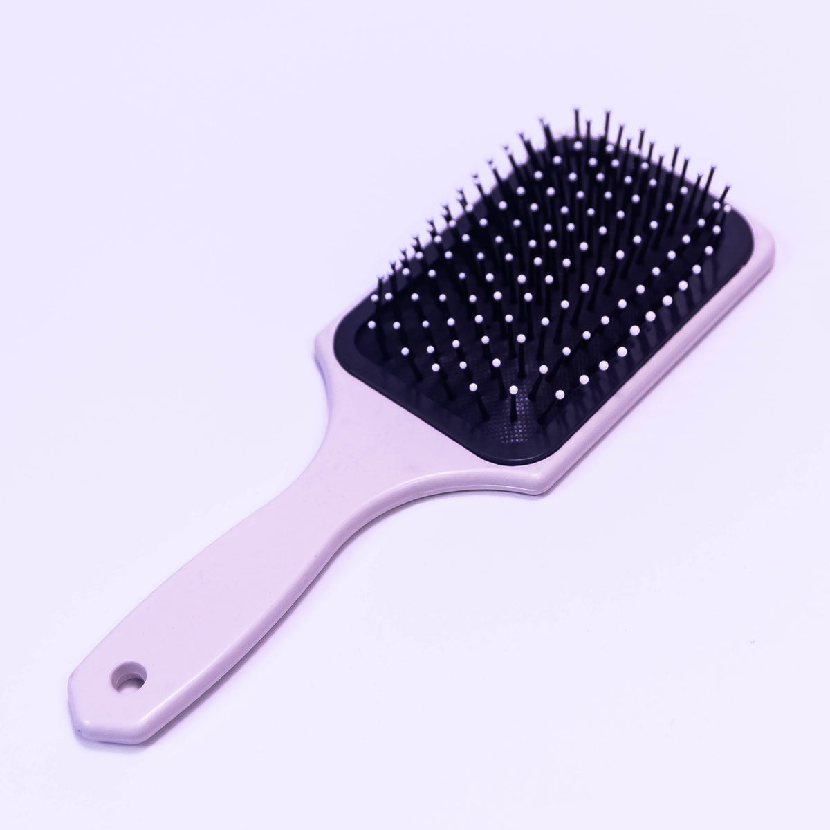 Printed pale violet hair brush by Zoni Stores, showcasing a stylish design and soft bristles for gentle hair styling.
