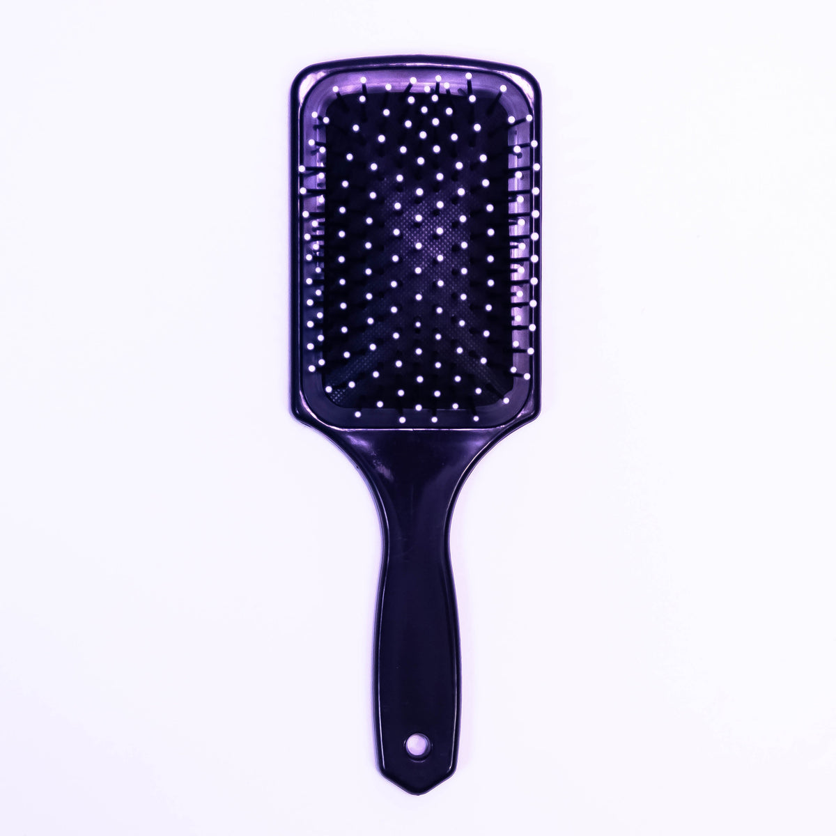 Printed black hair brush by Zoni Stores with textured handle and bristles for detangling and styling hair.