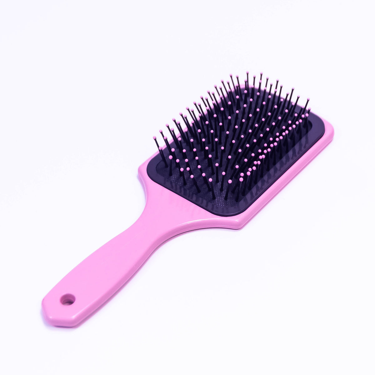 Pink star floral printed hair brush by Zoni Stores, showing a close-up of the brush with floral design and pink accents.