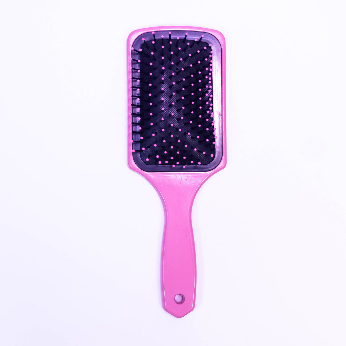 Light pink printed hair brush by Zoni Stores with a sleek handle and bristles for gentle styling.