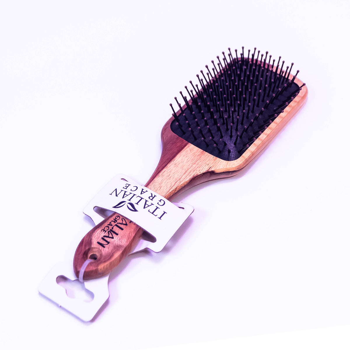Wooden hair brush by Zoni Stores with natural wooden bristles and ergonomic handle, ideal for gentle hair detangling.