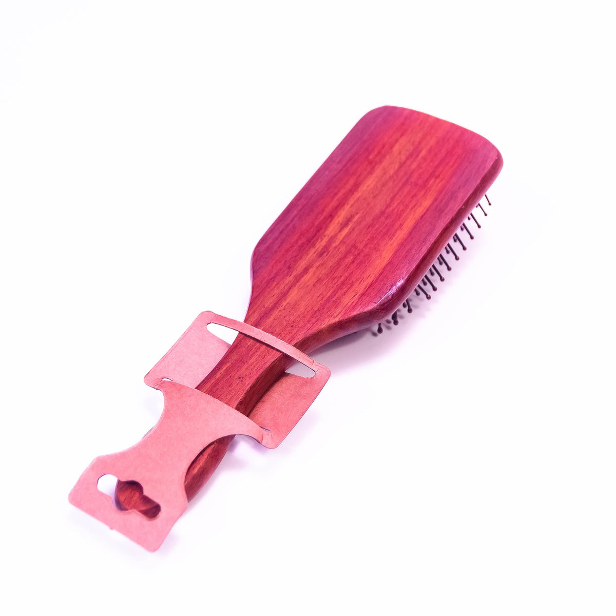 Wooden hair brush by Zoni Stores with natural bristles, showing the smooth wooden handle and bristle arrangement.