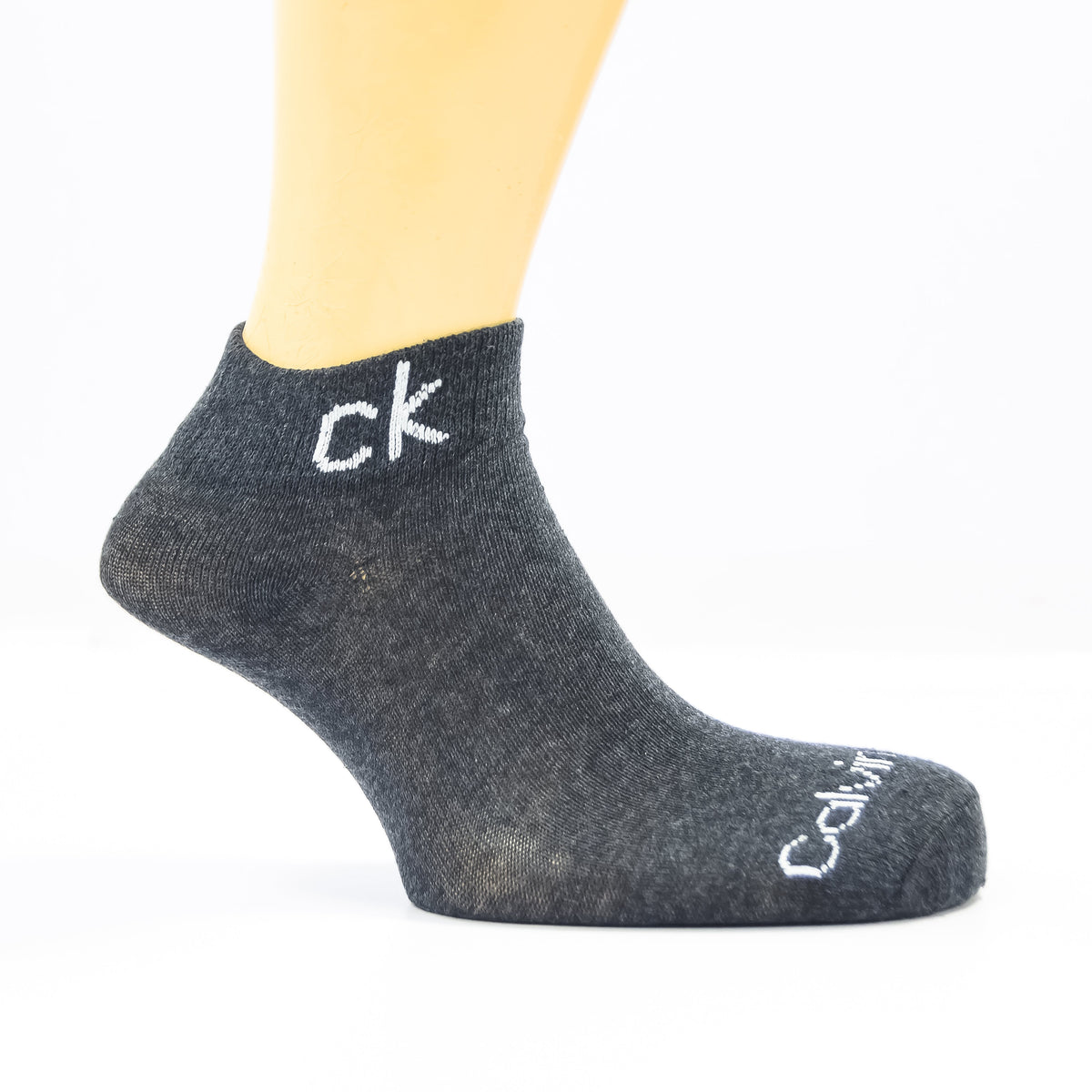 Pack of three Zoni Stores branded C-K ankle socks in black and white, shown laid flat with elastic cuffs and ribbed texture.