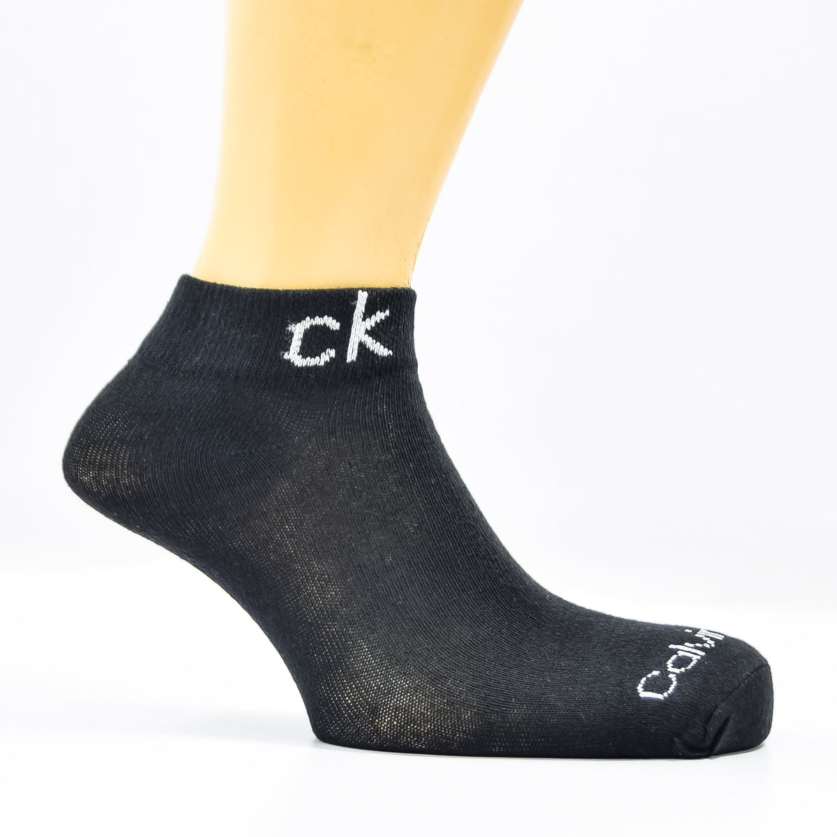 Pair of black branded C-K ankle socks from Zoni Stores, pack of three, featuring comfortable fit and branded logo details.