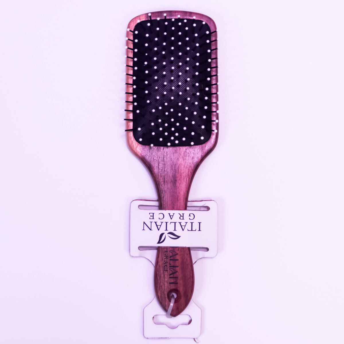 Wooden hair brush from Zoni Stores with natural bristles, showcasing its ergonomic design and smooth wooden finish.