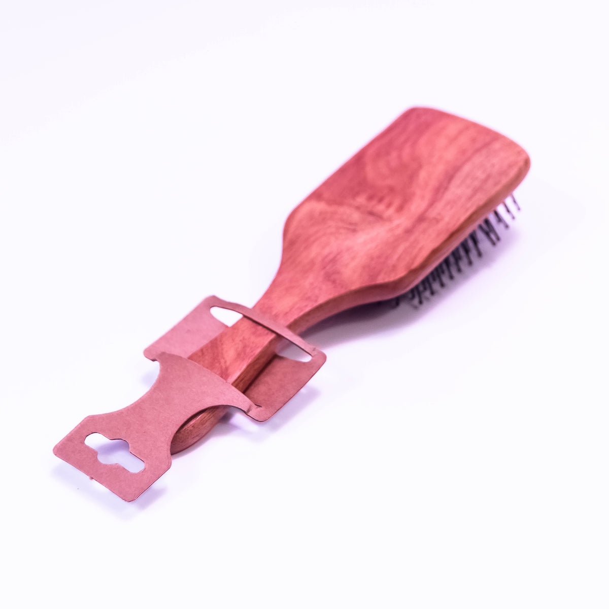 Wooden hair brush by Zoni Stores with natural wooden bristles and ergonomic handle, suitable for detangling and styling hair.