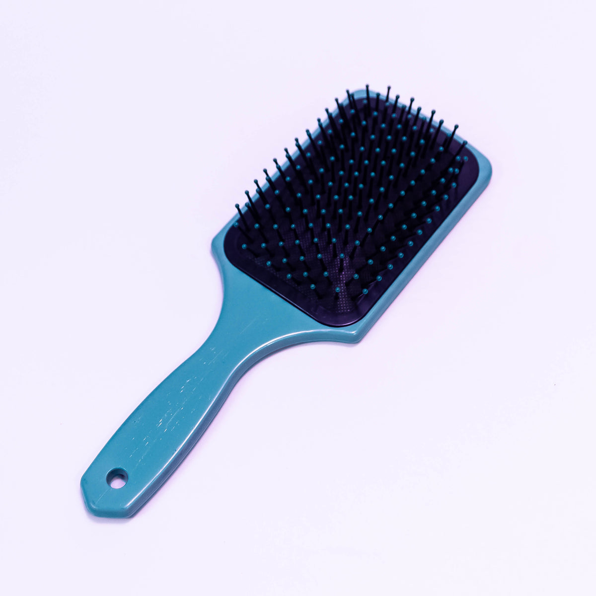 Lady dragon printed hair brush by Zoni Stores with colorful dragon design on a sleek plastic handle.