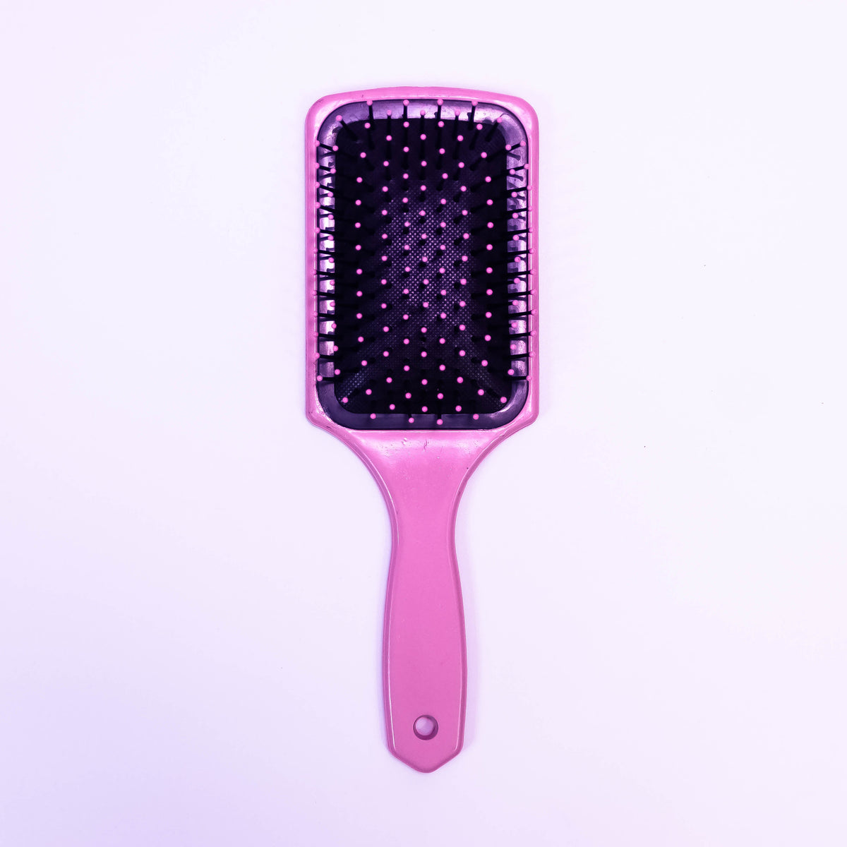 Printed Phoenix Fire hair brush by Zoni Stores with colorful fire design and bristles for gentle hair detangling.