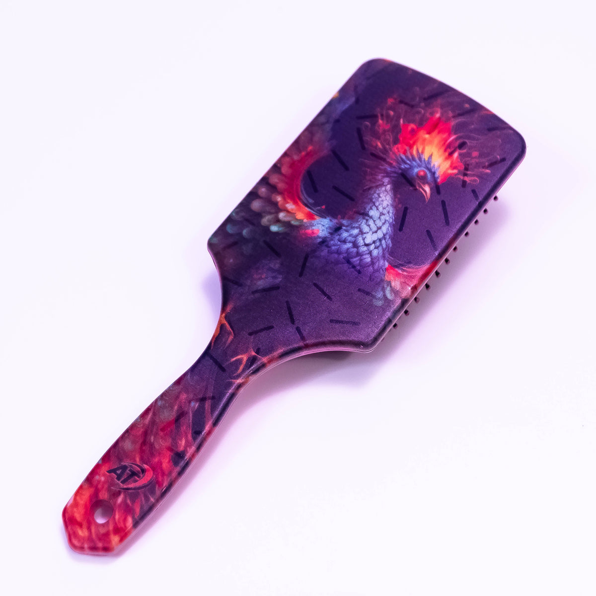 Printed Phoenix Fire hair brush by Zoni Stores featuring colorful fire-themed design and durable bristles.