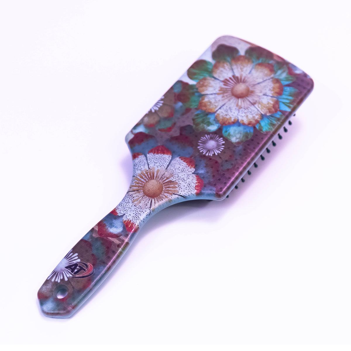 White mosaic floral printed hair brush by Zoni Stores, showcasing intricate floral design on a smooth, lightweight hairbrush.