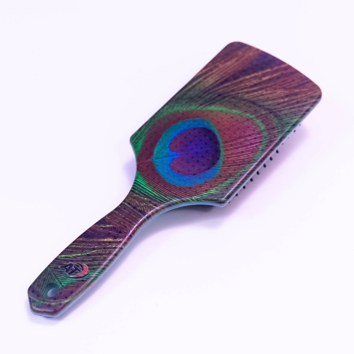 Peacock feather printed Zoni Stores hair brush with ergonomic handle and colorful feather design for easy styling.