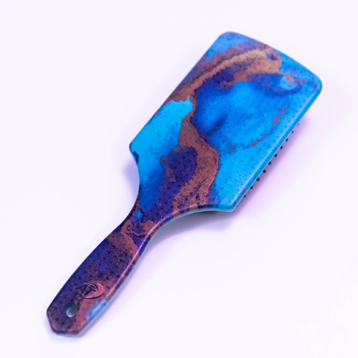 Arctic Blue printed hair brush by Zoni Stores with colorful design, featuring bristles for detangling and styling hair.