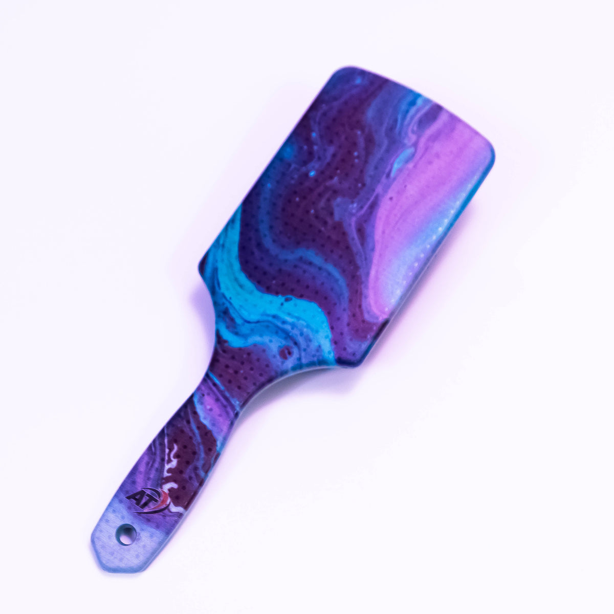 Colored Lava printed hair brush by Zoni Stores with textured bristles for gentle hair detangling and styling.