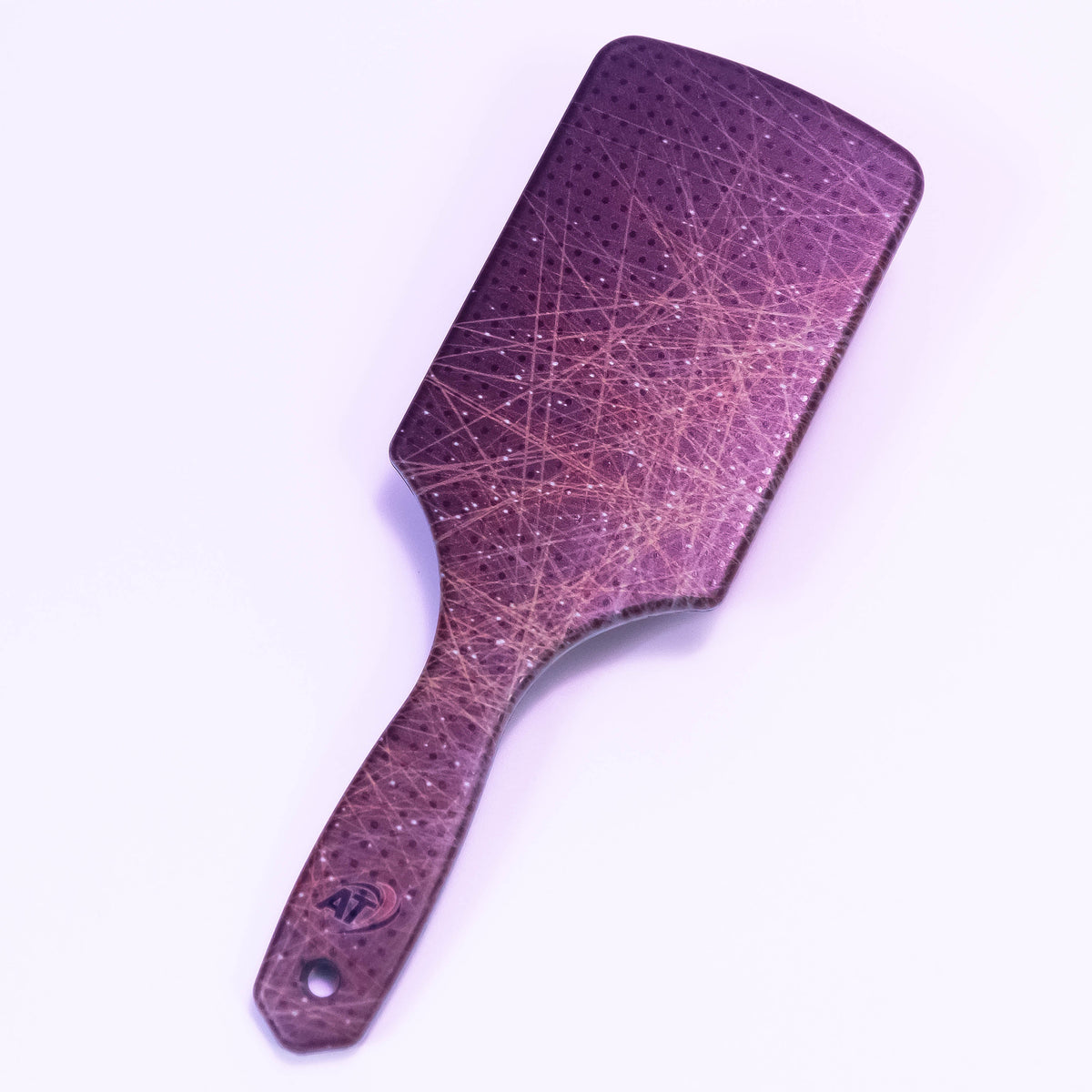 Star Dust printed hair brush by Zoni Stores with colorful star pattern and ergonomic design for gentle hair brushing.