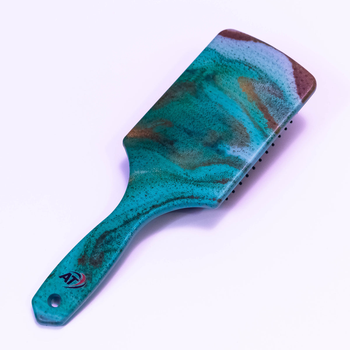 Green printed hair brush by Zoni Stores featuring a stylish design and ergonomic handle for gentle hair detangling.