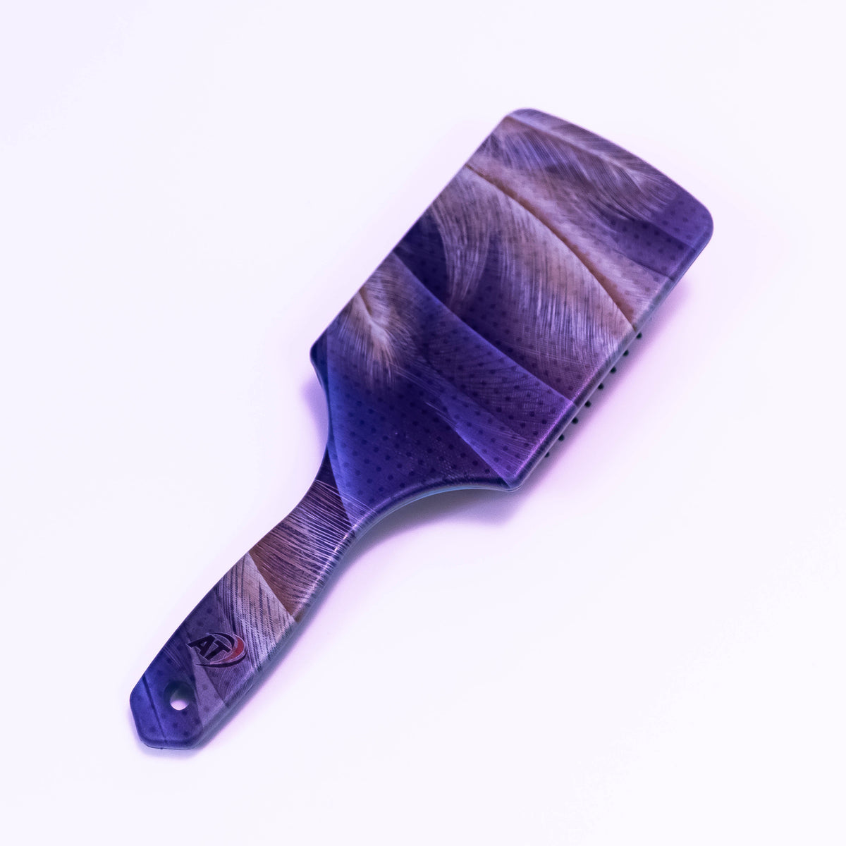 Owl feather printed hair brush by Zoni Stores with decorative owl feather design, suitable for detangling and styling hair.