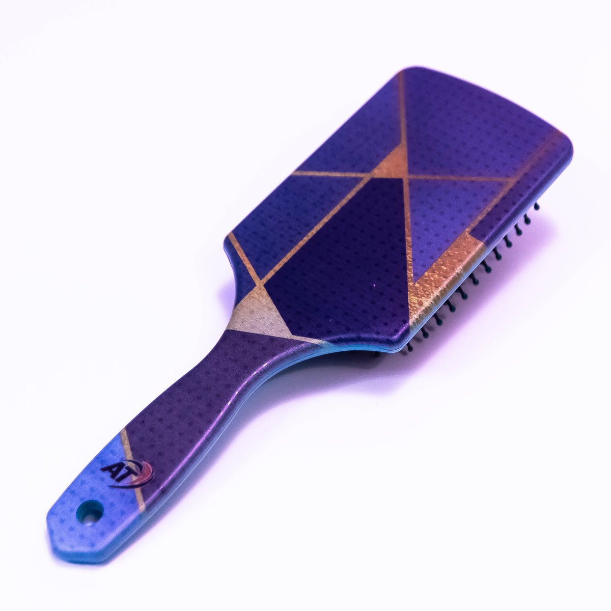 Blue mosaic printed hair brush by Zoni Stores with colorful mosaic design, shown in close-up on white background.