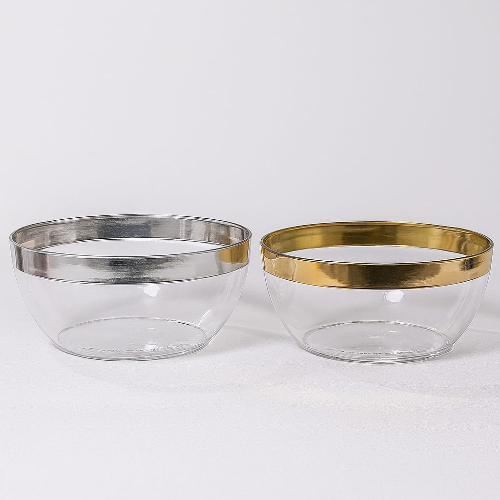 Two decorative clear glass bowls featuring gold and silver rims, available at Zoni Stores.