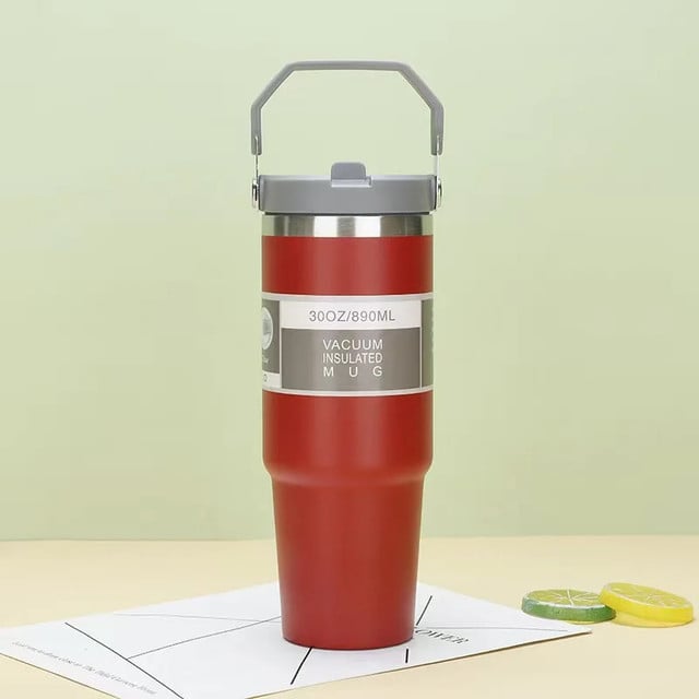 Double wall insulated coffee cup with straw and fold down handle available at Zoni Stores