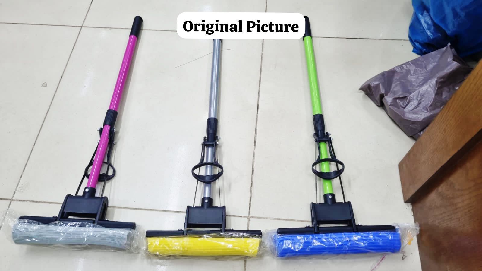 Hands-free self-squeezing absorbent foam mop showing the built-in wringing mechanism for quick household floor cleaning