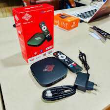 MagicPlay Android TV box complete package including remote, power adapter, and HDMI cable, available at Zoni Stores Pakistan.
