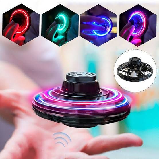 A colorful rechargeable flying fidget spinner displayed right next to its sleek, branded cardboard retail packaging box