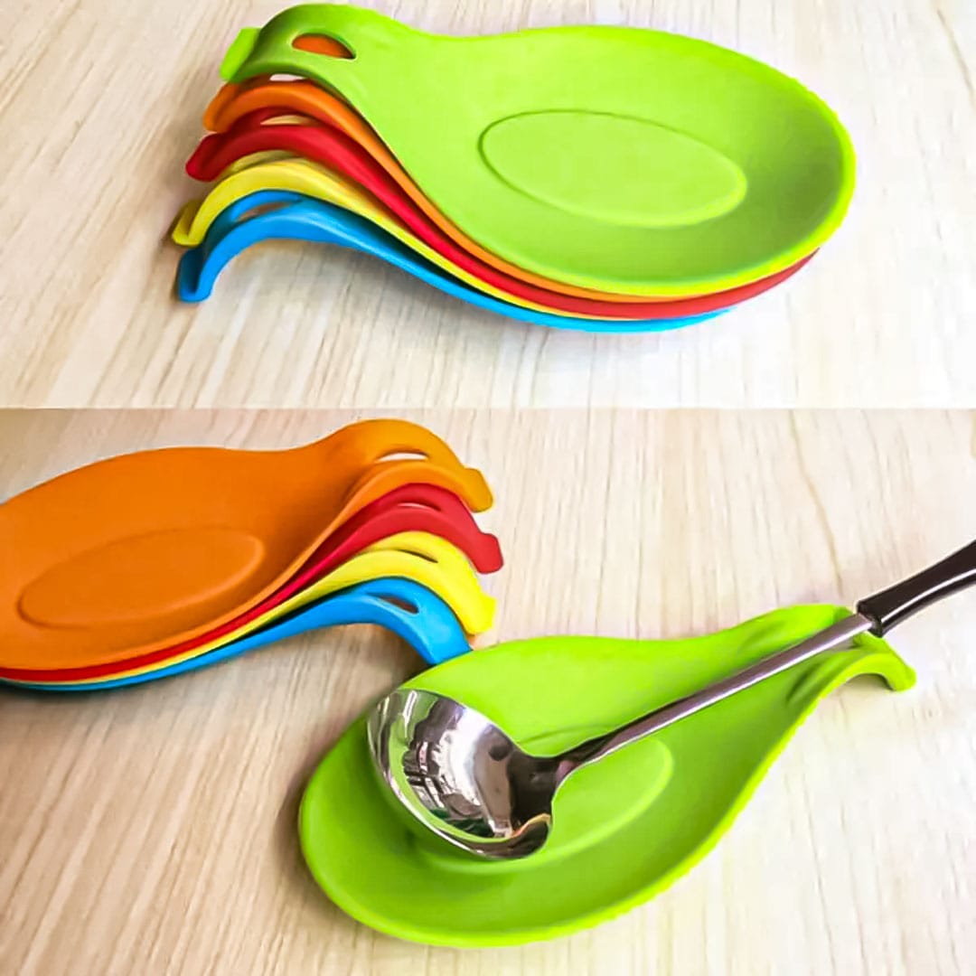 Colorful silicone spoon rest holders stacked and holding a ladle on a wooden surface available at Zoni Stores Pakistan