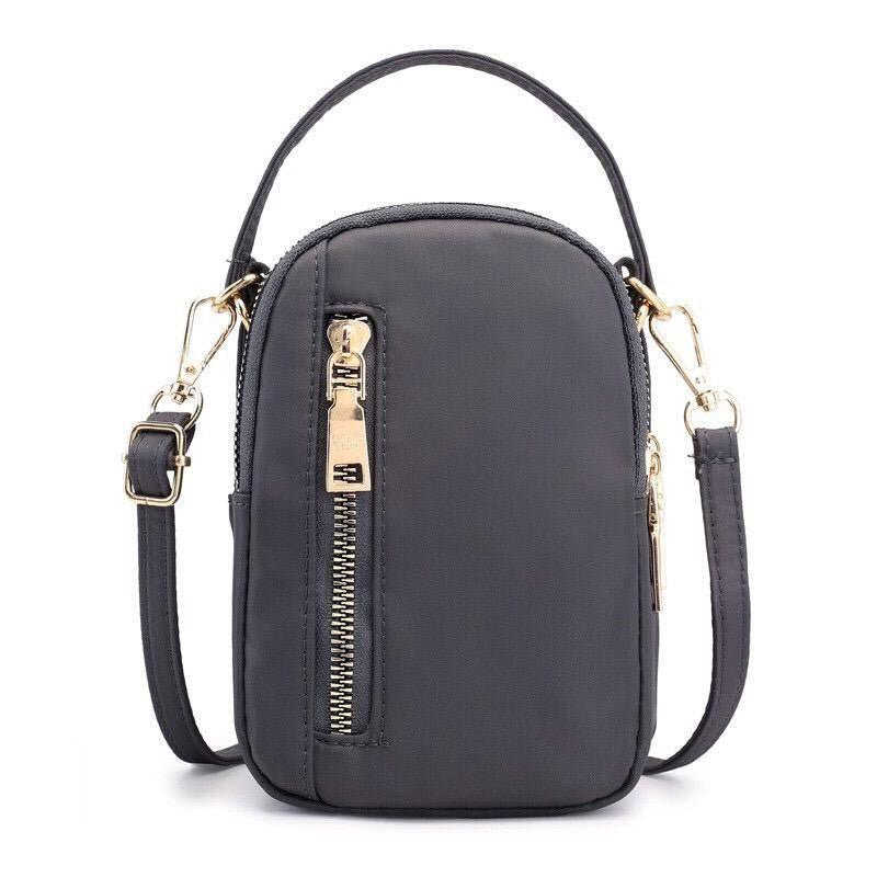 Premium nylon mini handbag with gold-toned metallic zippers and clasps available at ZoniStores