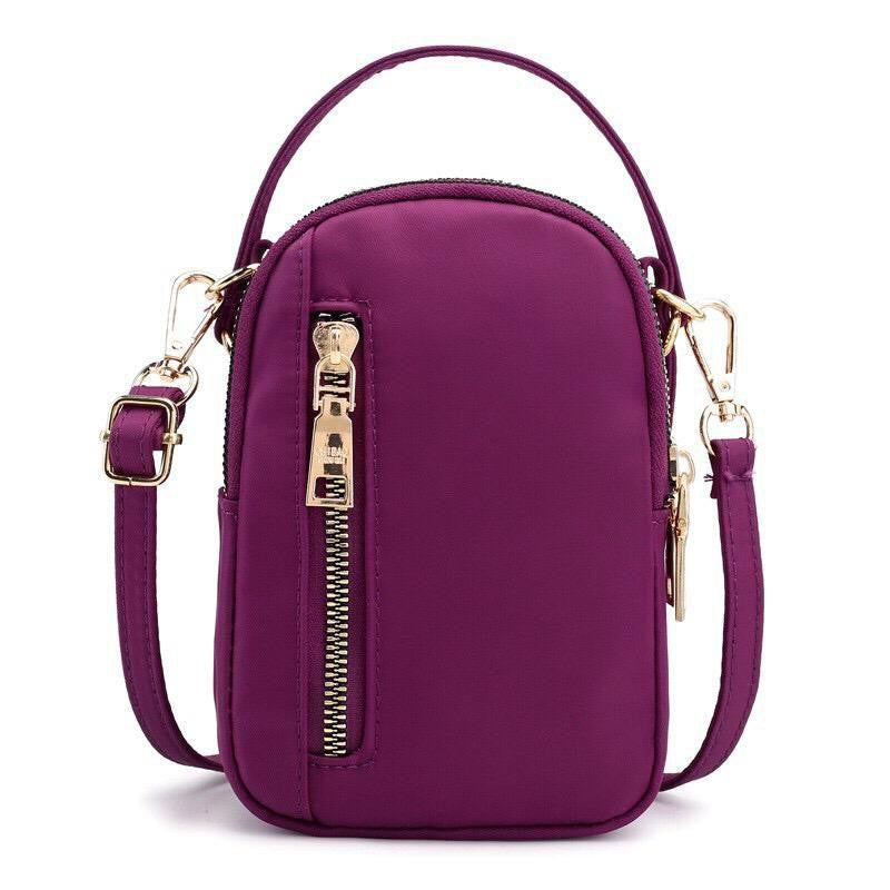 small crossbody bag with top handle and golden accents, ideal for gifting in Pakistan - ZoniStores