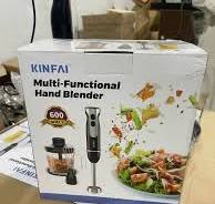 Multi-functional hand blender system showing the transparent chopping bowl and mixing cup accessories on a package box